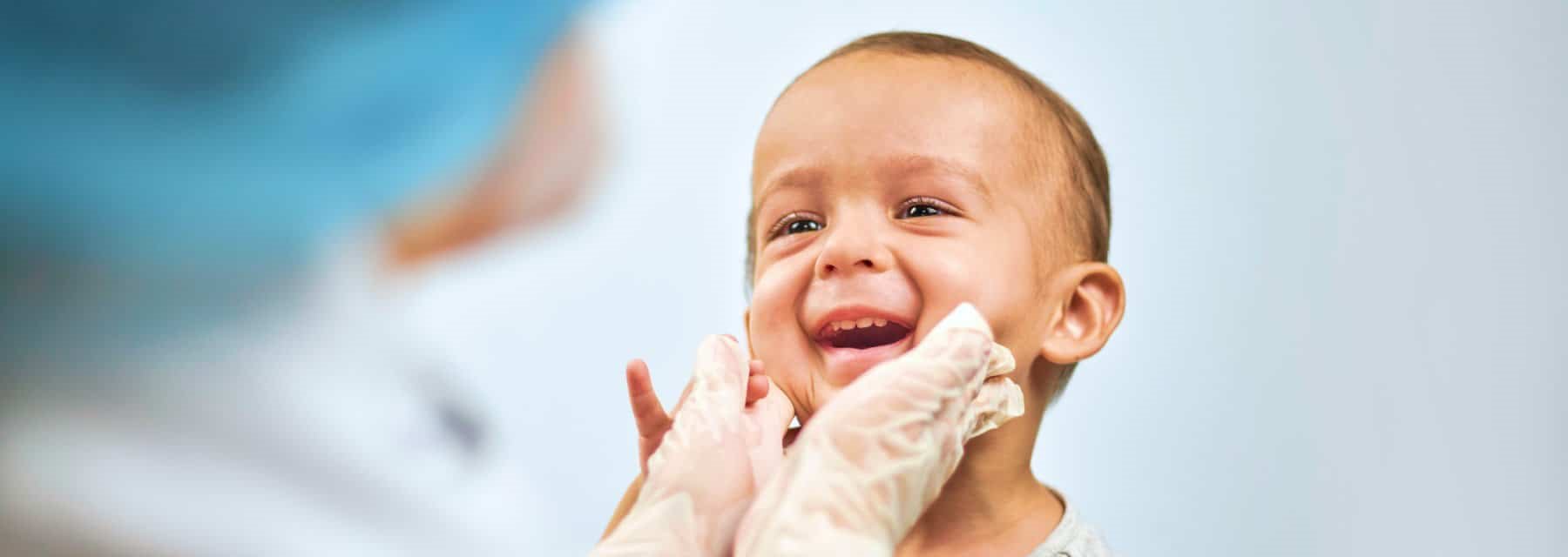 A doctor examines a baby, Spokane Valley Washington