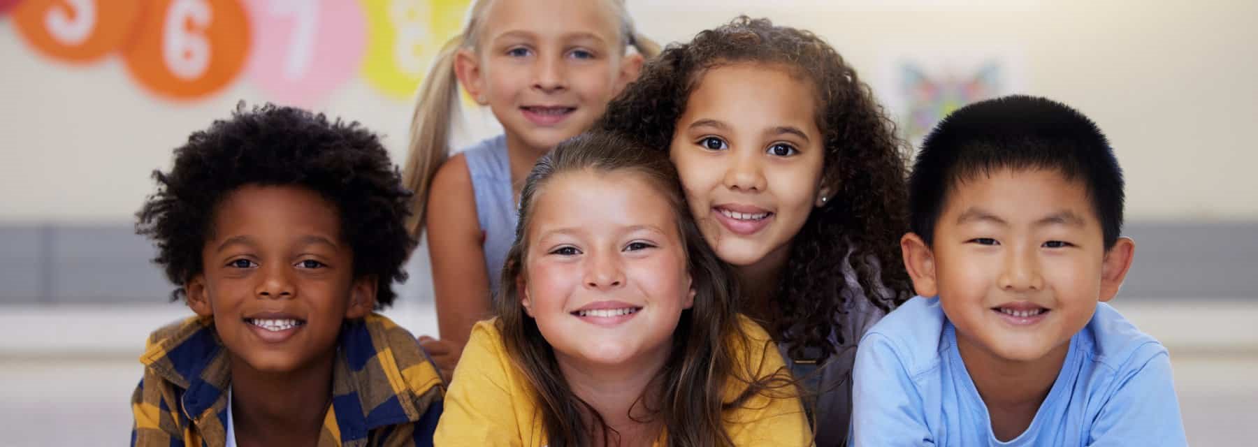 A cheerful group of children smiles, Spokane Valley Washington
