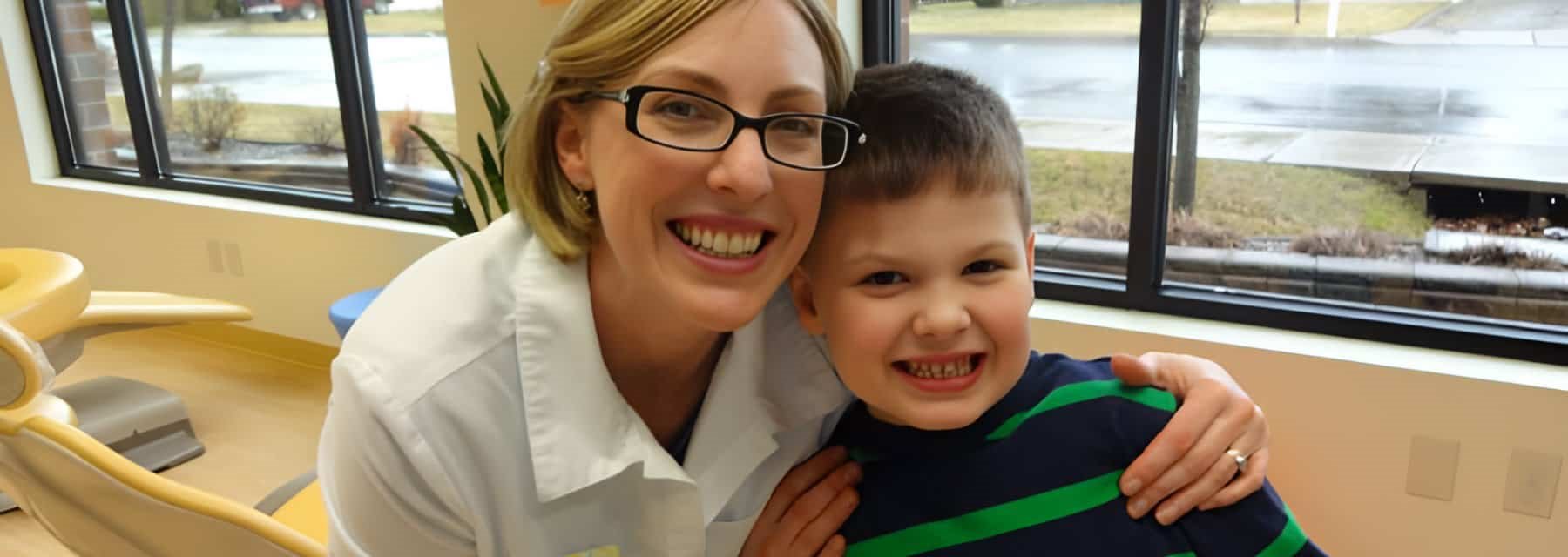 A woman and a child in a dental office at Mollygunsaulis, Spokane Valley Washington